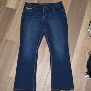 Classic Blue Boot Cut Jeans with Subtle Fading